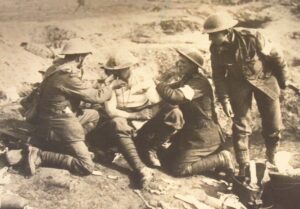Stretcher Bearers provide first aid to wounded soldier in frontlines.