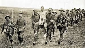 POW being assisted by colleague and CAMC medic WW I