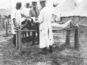 CAMC personnel treat wounded soldier in France