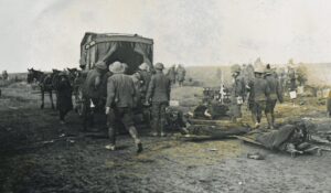 Casualties being loaded on a horse drawn ambulance
