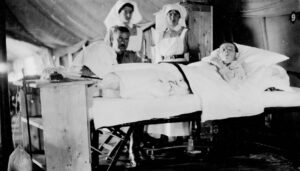 Canadian Army Medical Corps Nursing Sisters provide bedside patient care